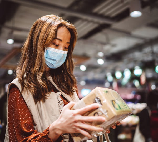 Female customer shopping while wearing mask